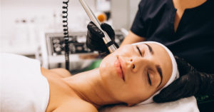 A beautiful woman undergoing facial medical spa