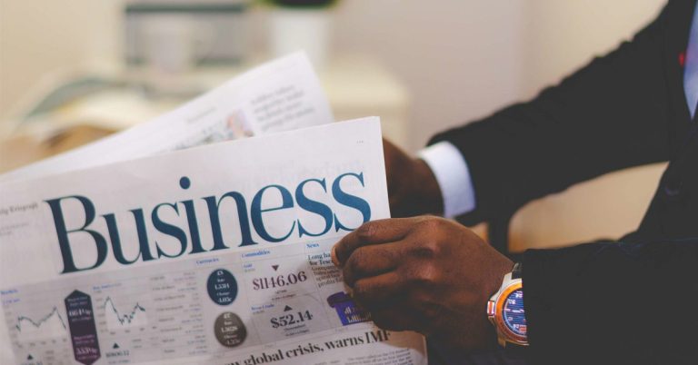 person holding a newspaper