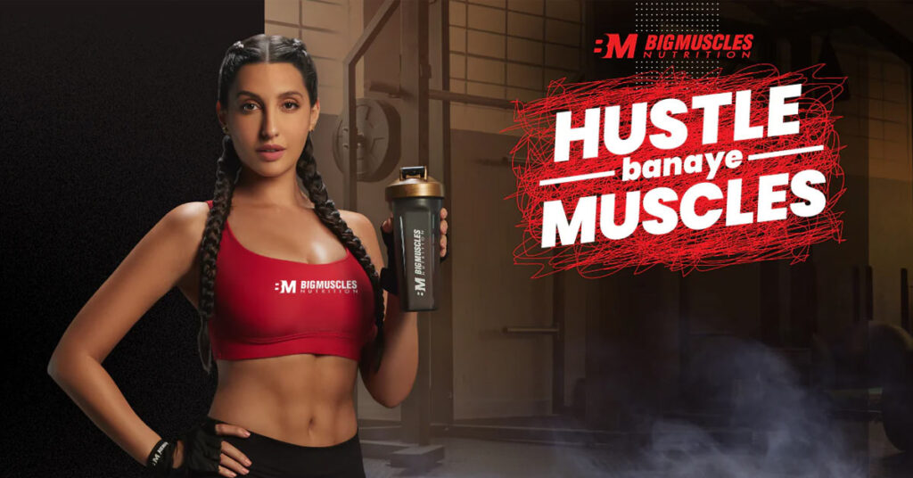 BigMuscles' 'Hustle Banaye Muscles' ad campaign banner featuring Nora Fatehi.