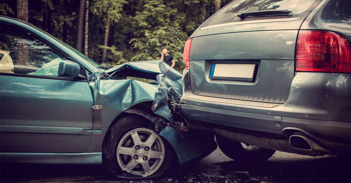 A photo depicting a car hitting another from behind