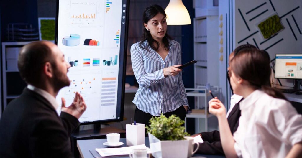 A female HR manager instructing the employees.