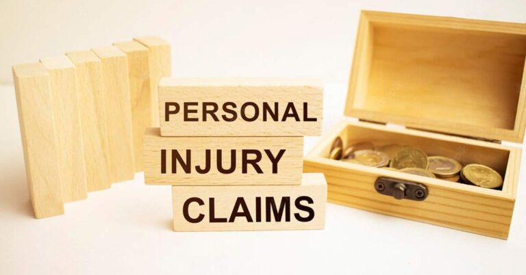 Wooden blocks with "Personal Injury Clams" written kept with a wooden box of coins.