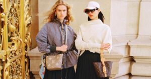 A couple of young women sporting their respective Louis Vuitton handbags