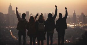 A team of five people photographed from the backside in an urban setting .