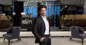 Bollywood Superstar Shahrukh khan standing in Elan Group's premises