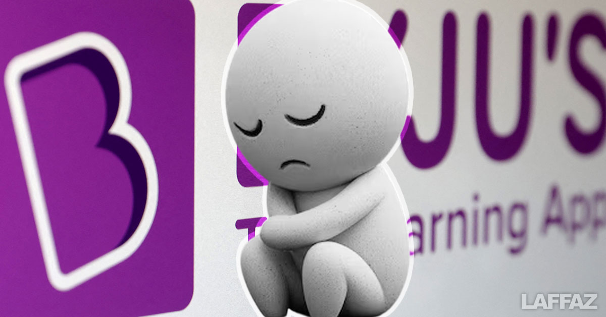 A sad-faced emoji cartoon character sitting in front of a Byju's logo background