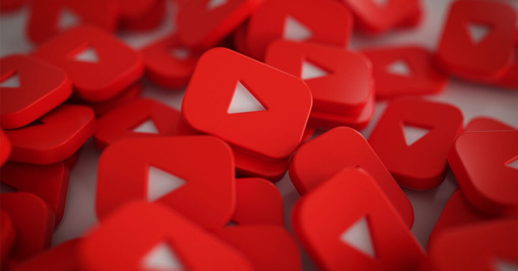 Pile of 3D YouTube Play Button Logos.