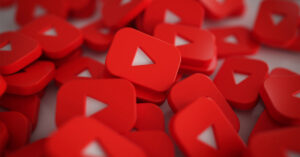 Pile of 3D YouTube Play Button Logos.