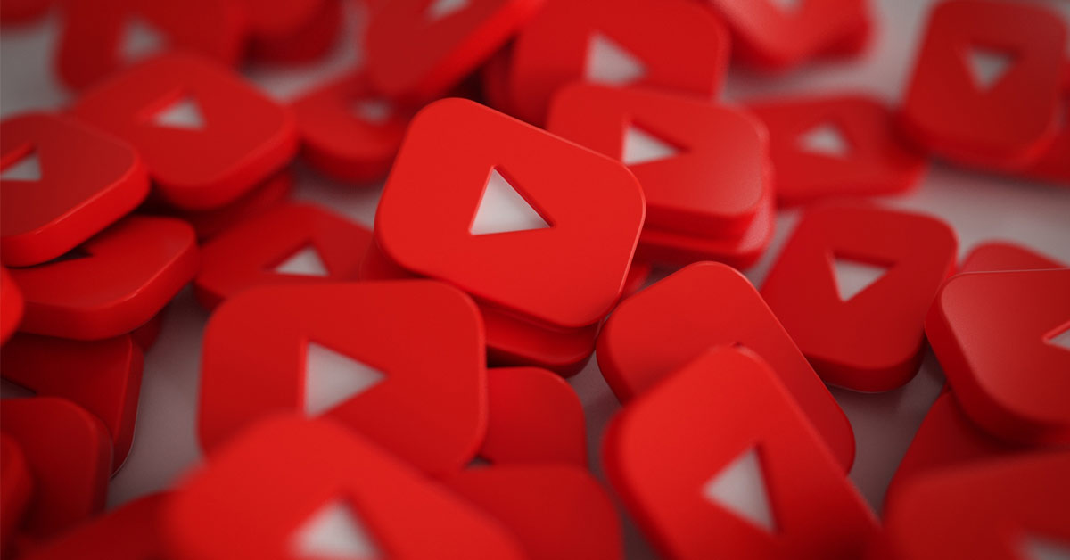 Pile of 3D YouTube Play Button Logos.
