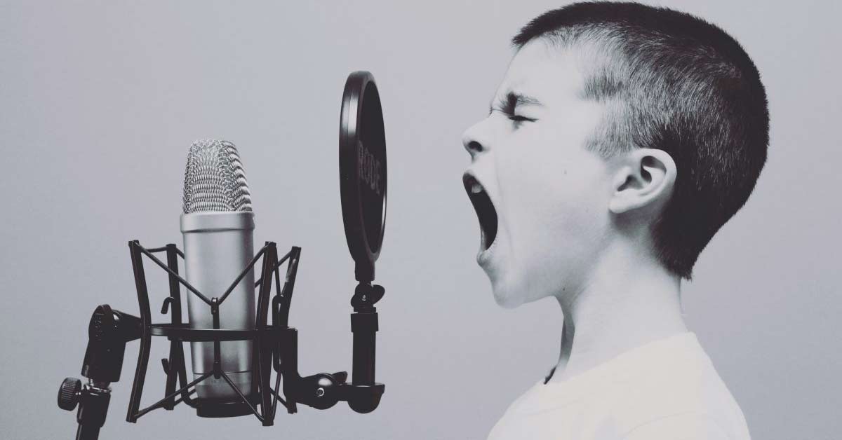 A young boy shouting on a mic - depicting an online venting chat concept