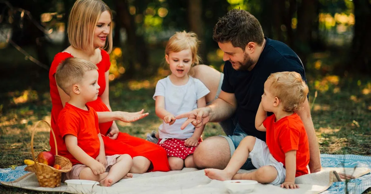 A happy family enjoying weekend activities together outdoors, symbolizing fun and bonding time for parents and children.