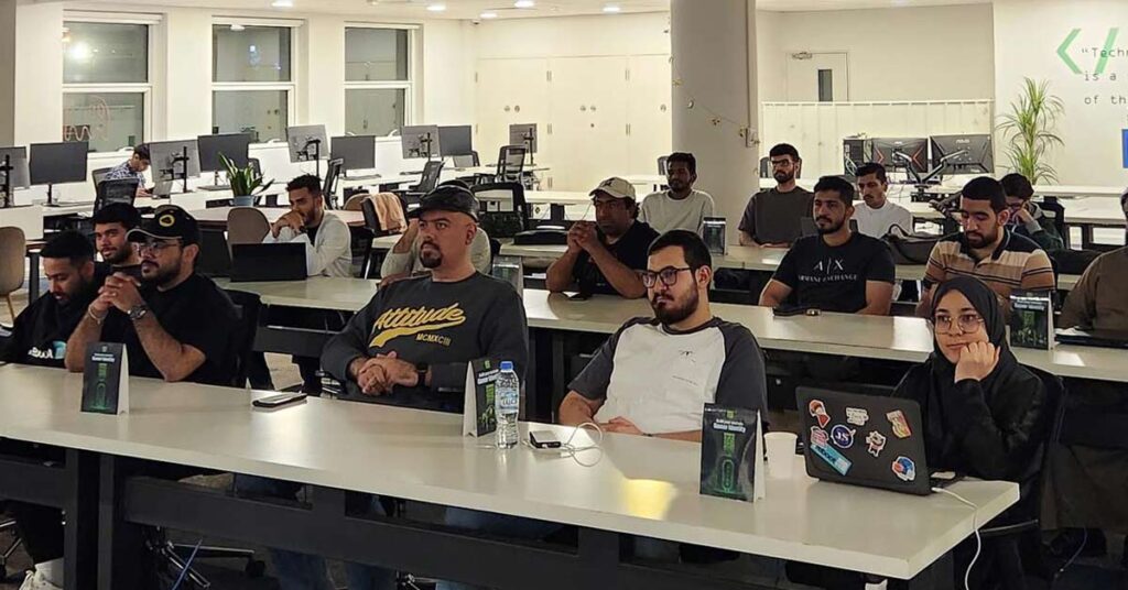 Bahraini students attending a classroom session at Reboot Coding Institute, Bahrain