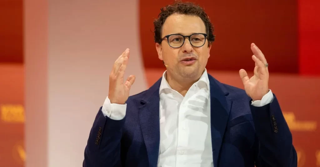 Dario Amodei, CEO of Anthropic, as judge delays $1.5 billion author settlement and Microsoft strengthens collaboration with the AI firm