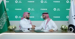 Ahmad Al-Zaini, CEO of Foodics, and Hisham Al-Falih, CEO of Lean Technologies, signing fintech partnership to empower Saudi restaurants at Money20/20 Middle East 2025.