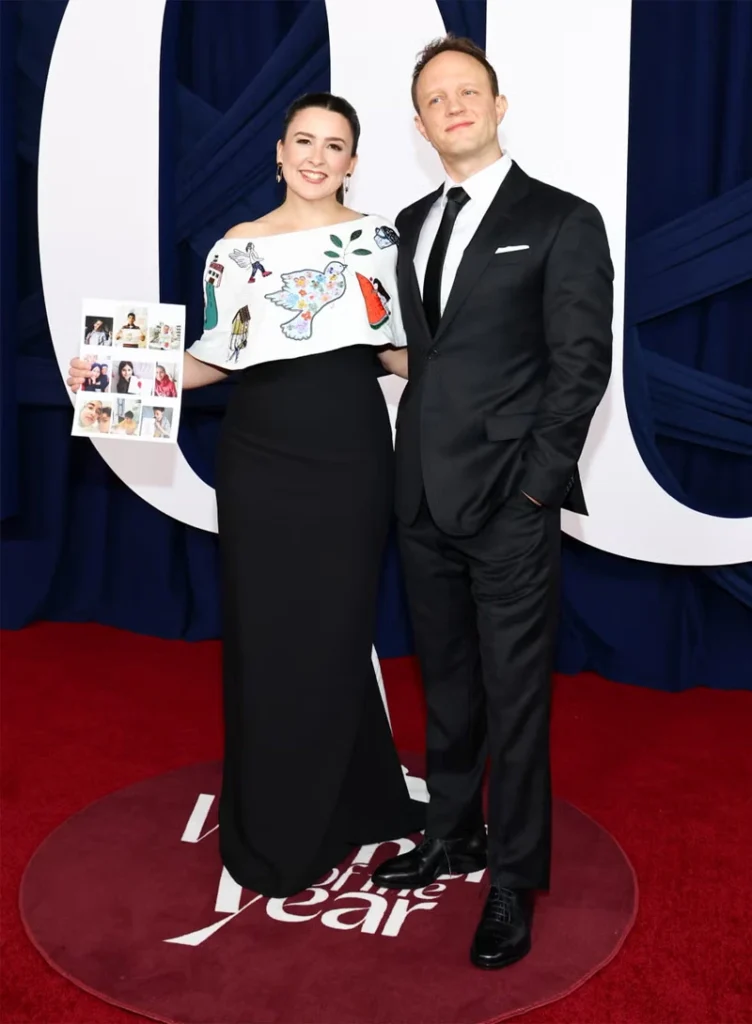 Arriving at the event with her husband, Aron Accurso - known affectionately to fans as Mr. Aron - Ms. Rachel turned heads in her upcycled gown featuring embroidery on the capelet and train. The designs were drawn from sketches sent to her by Gazan children.