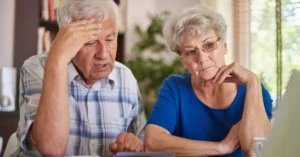 An old-age couple with sad expression
