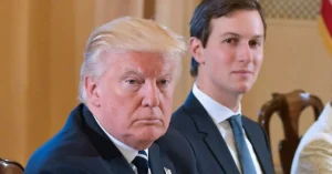 Donald Trump standing alongside Jared Kushner during a public appearance.