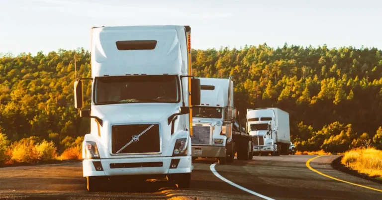Semi-truck traveling on an open highway, representing the mobility infrastructure that supports emerging startups.