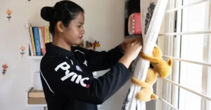 A Pync service professional cleaning a household