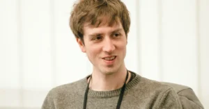 Quora CEO Adam D'Angelo speaking at a tech event