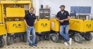 Flo Hauler autonomous mobile robot transporting construction materials on an Indian building site