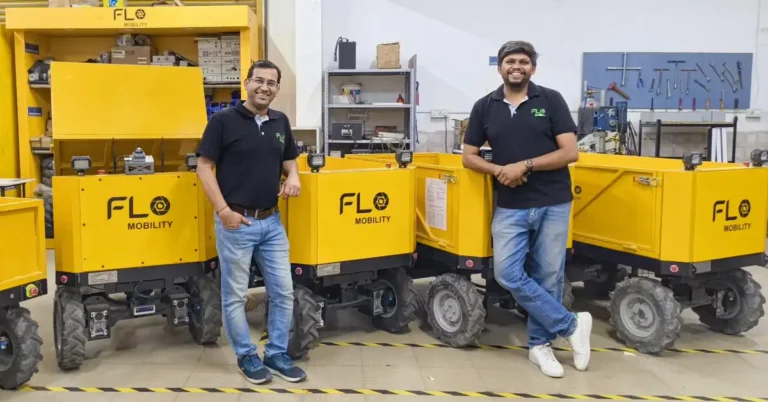 Flo Hauler autonomous mobile robot transporting construction materials on an Indian building site