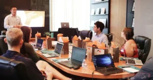 A business professional reviewing tech strategy on a laptop, representing digital transformation and business growth in 2026