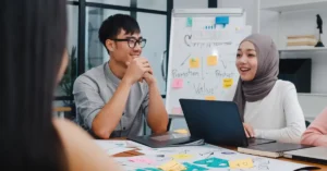 Indonesian software developers working on global digital tools in a Jakarta tech hub