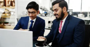 Indian business owners reviewing exit planning options with an M&A advisor