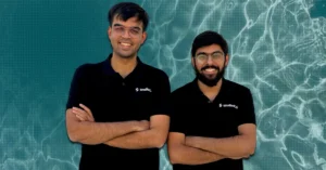 Smallest.ai co-founders Sudarshan Kamath and Akshat Mandloi standing together