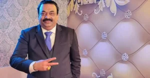 CJ Roy, founder and chairman of Confident Group, in a formal suit at a social event