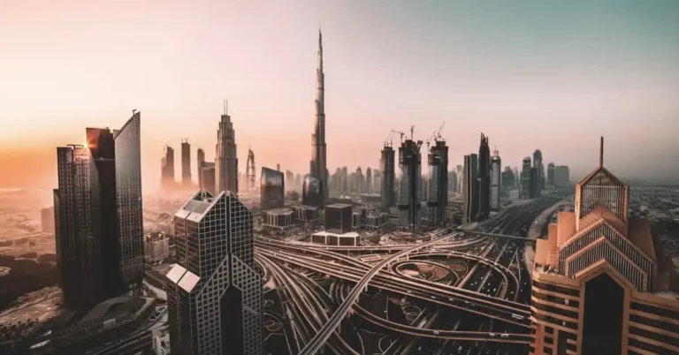Dubai skyline at golden hour with the Burj Khalifa above a highway interchange, representing forex brokers regulated in the UAE